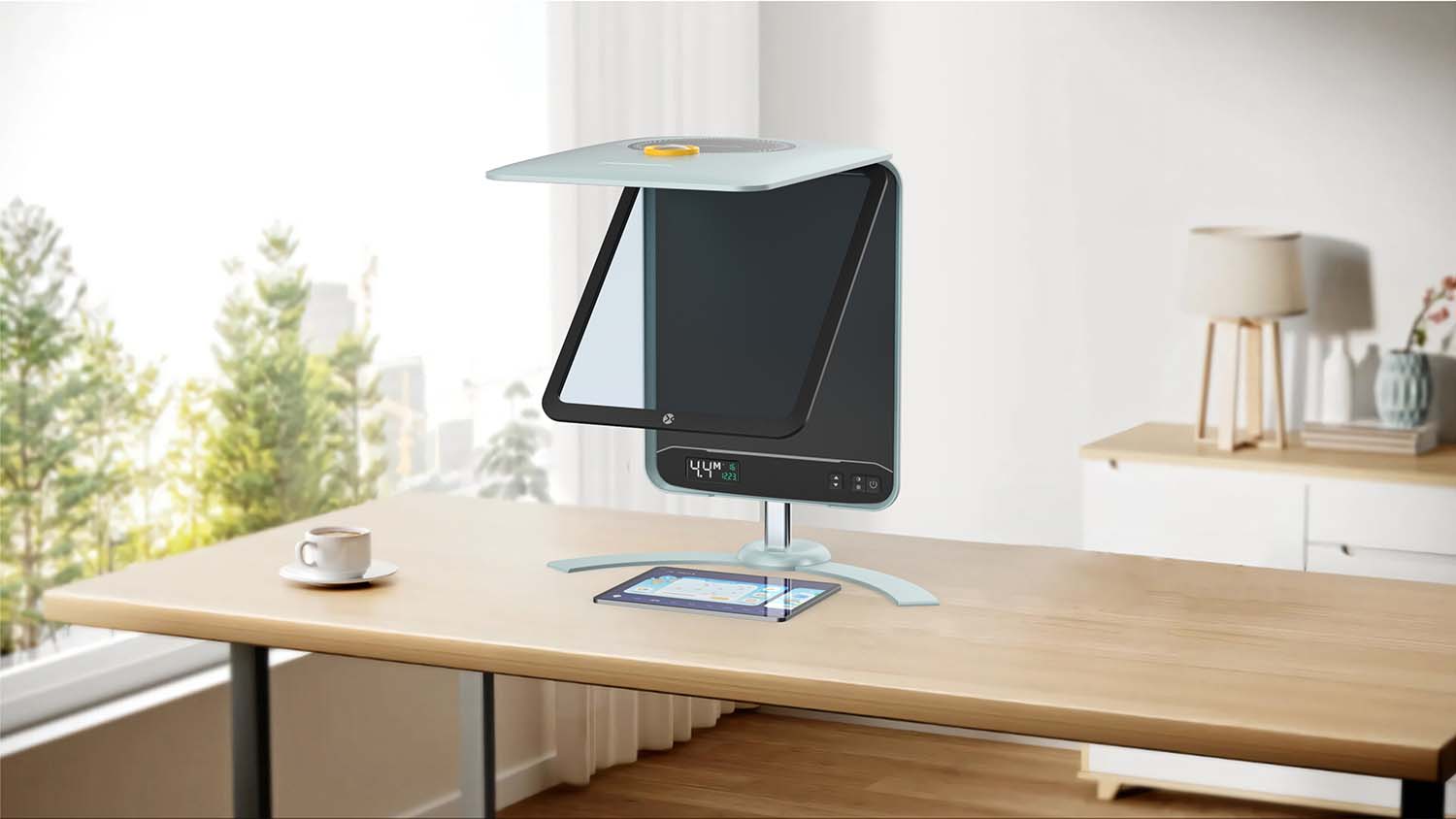 MAXIGHT Reader Edition standing on a wooden desk beside a window